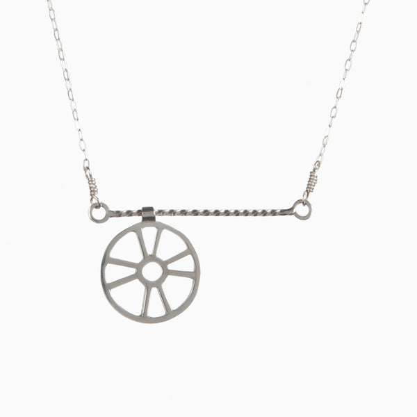 The Moving Life Preserver on a Rope Necklace has a ring buoy charm that moves across a twisted wire rope bar necklace. A great gift for the "lifesaver" in your life, from a collection of kinetic jewelry and playful nautical necklaces.