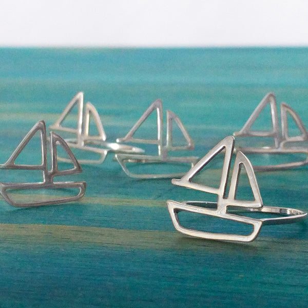 A group of silver Sailboat Rings by Tinker Company. From a collection of fun and playful nautical jewelry designs sustainably made in New York City.
