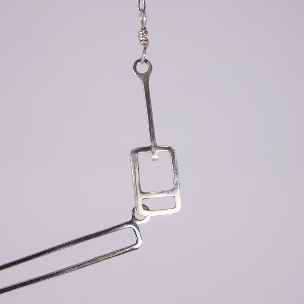 Detail of the lift ticket clasp on the Ski Gondola Necklace