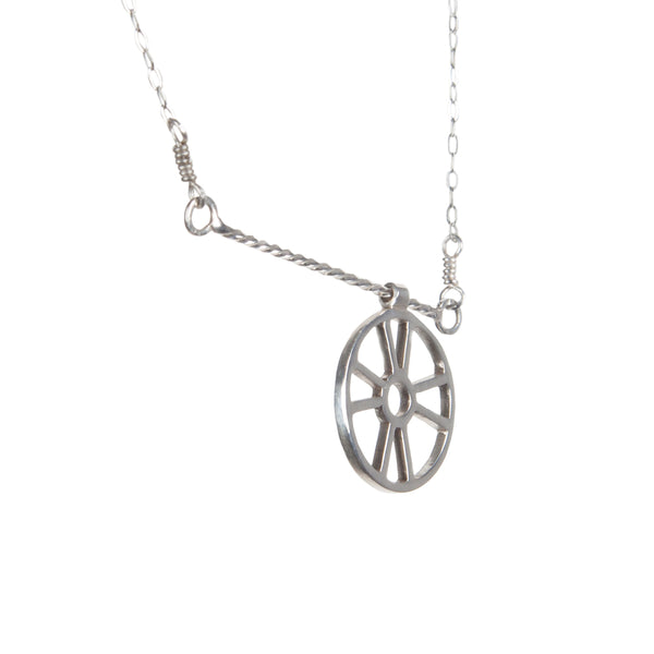 Kinetic Necklace with Moving Life Preserver has a ring buoy charm that moves across a twisted wire bar necklace designed to look like rope. A great symbolic gift for the "lifesaver" in your life, from a collection of kinetic jewelry and playful nautical necklaces.