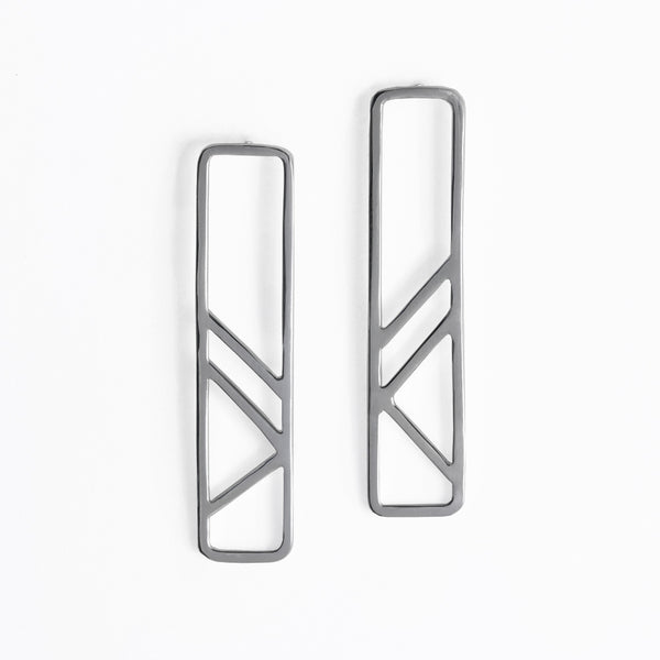Modern and minimal geometric earrings inspired by the metal column pillars supporting the subway tracks. Part of the City Collection of architectural jewelry by Tinker Company made in New York City.