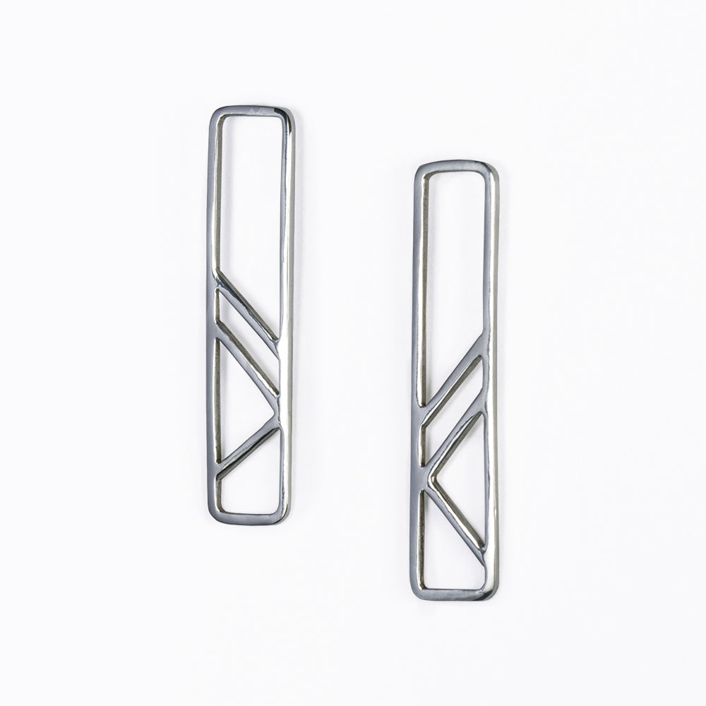 Architectural Pillar Earrings in sterling silver. This jewelry design was inspired by the clean lines of geometric architectural support systems. Made in NYC by Tinker Company.