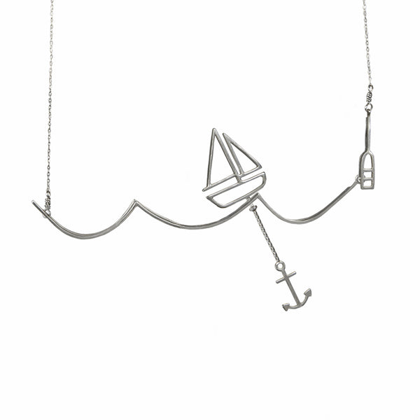 Silver Sailing Necklace with Moving Sailboat on a Wave from a collection of fun and playful kinetic jewelry by Tinker Company.