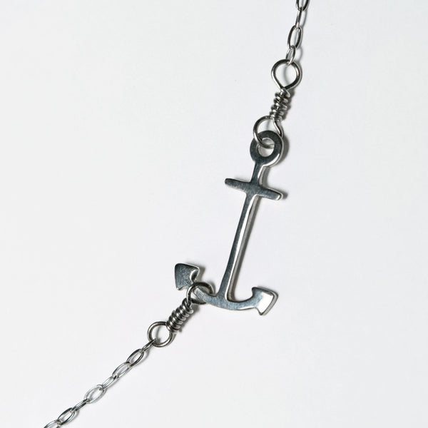 Anchor Pendant in Sterling Silver is a necklace with a minimal anchor charm on a delicate chain. Part of a collection of fun and playful nautical jewelry by Tinker Company. Celebrate your favorite summer travel and vacation memories of days spent on the water.