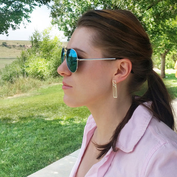 Silver Flying Buttress Earrings on a model. Travel and architecture inspired jewelry by Tinker Company.