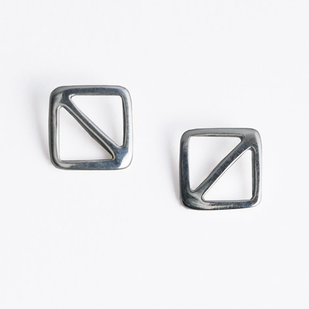Overboard Flag Stud Earrings in sterling silver, a minimal geometric design inspired by the letter O signal flag, the symbol for man overboard. From a collection of fun and playful nautical jewelry by Tinker Company.