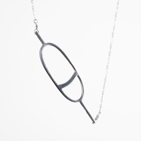 The sterling silver Oval Nautical Buoy Pendant has a simple minimal oval buoy charm on a delicate chain. Sentimental jewelry to remind you of your favorite summer travel and vacation memories on the water. 