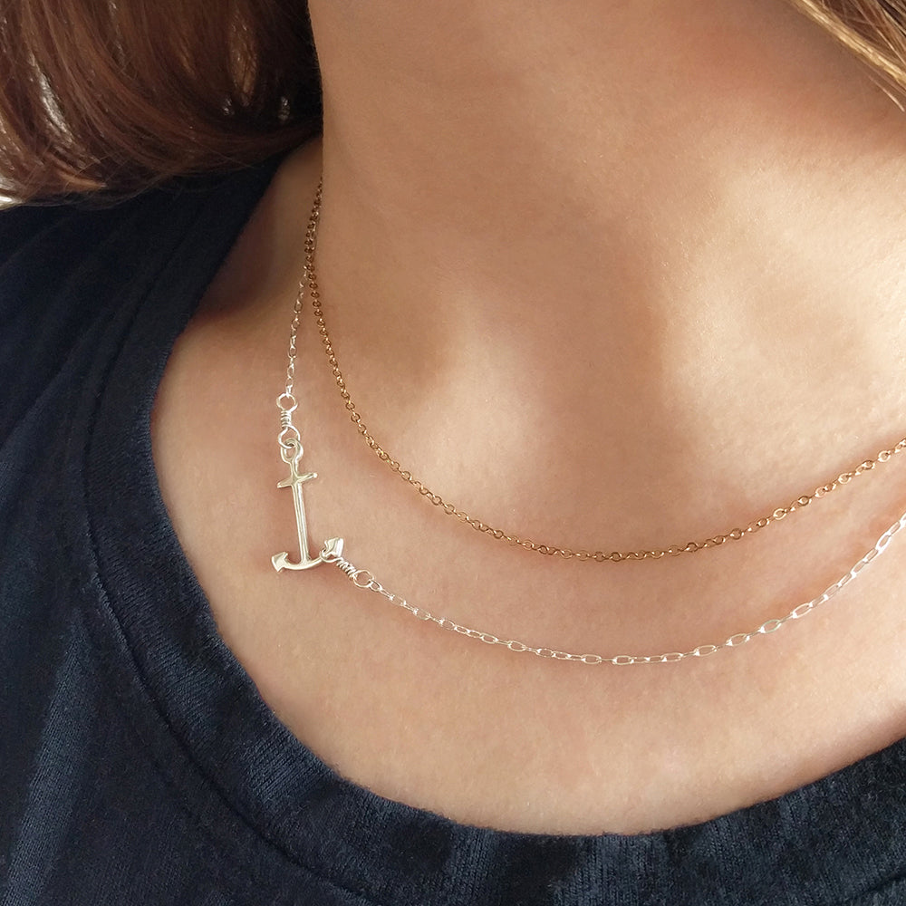 Silver Anchor Pendant shown on model, with "on the side" option. Part of a fun and playful nautical jewelry collection by Tinker Company. Sustainably made in NYC.