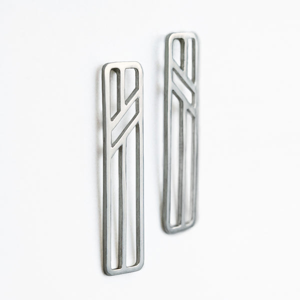 Telephone Pole Earrings in sterling silver by Tinker Company. Part of a collection of abstract geometric jewelry celebrating the everyday things that connect you to your loved ones even when you're far apart.