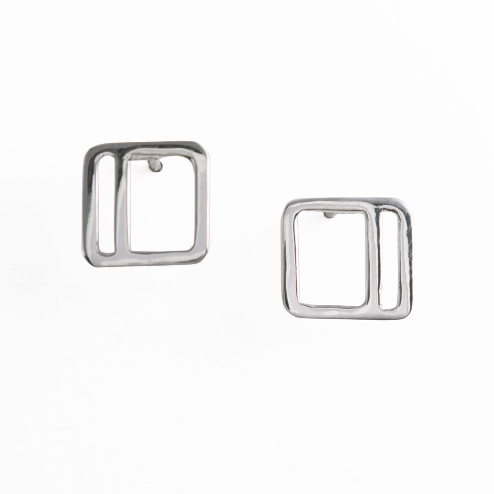 Silver square stud earrings with an offset vertical stripe from a collection of minimalist style geometric jewelry by Tinker Company.