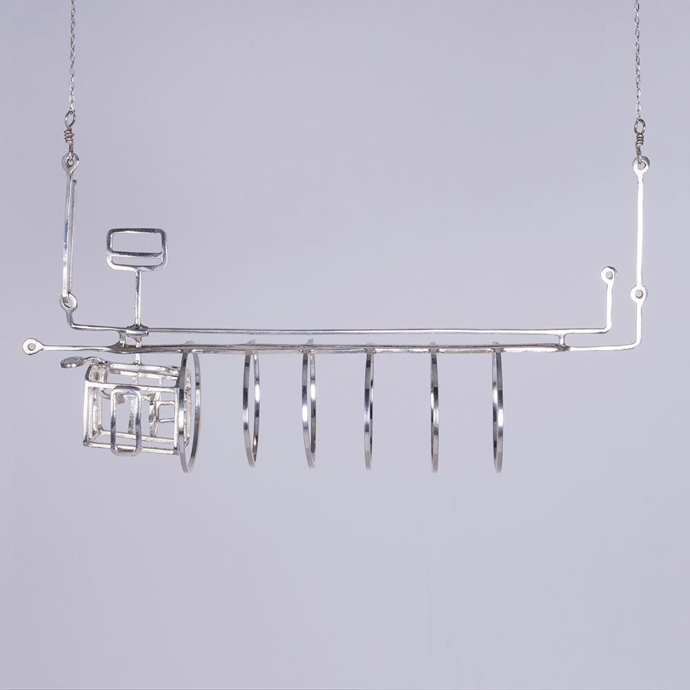 Subway necklace with tunnel and moving train car