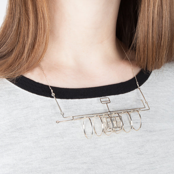 Subway necklace shown on model