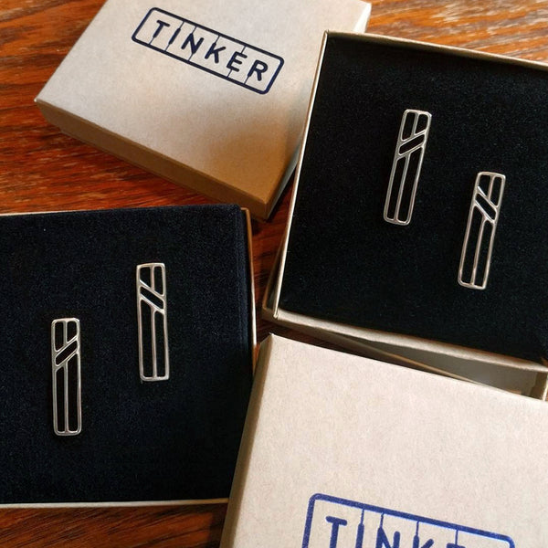 Telephone Pole Earrings in sterling silver by Tinker Company. Part of a collection of abstract geometric jewelry celebrating the everyday things that connect us. Shown here in Tinker gift boxes.