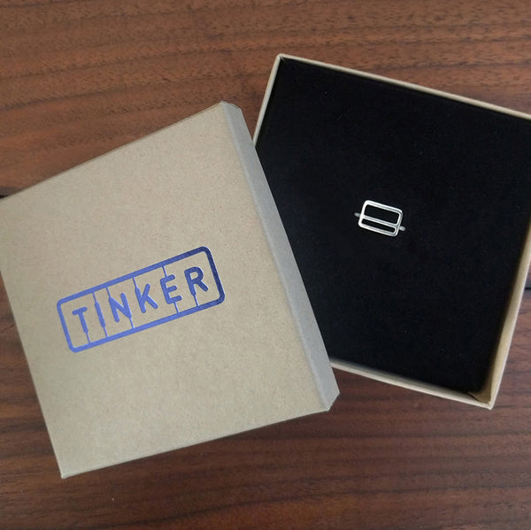 Metrocard Ring shown in a Tinker Company box.