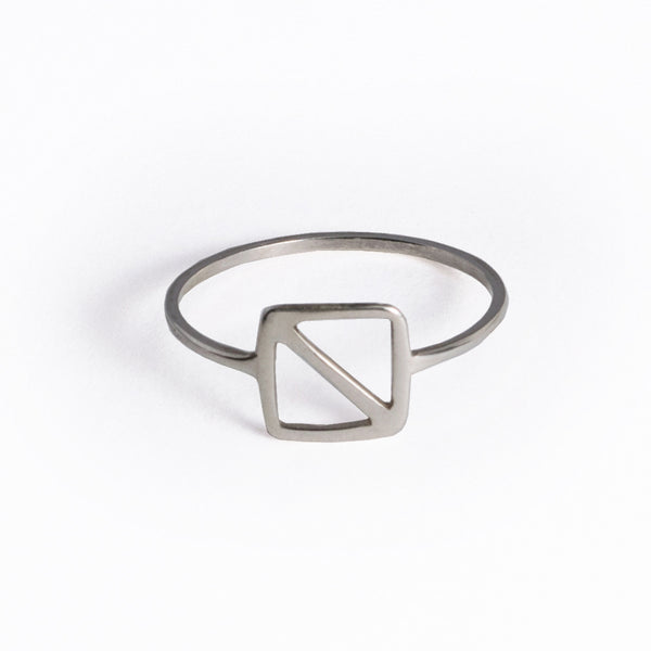 Sterling Silver Overboard Nautical Alphabet Flag Ring is in the shape of a square with a diagonal line inspired by the letter "O" nautical flag, the signal flag for "man overboard!" From a collection of symbolic jewelry by Tinker Company.