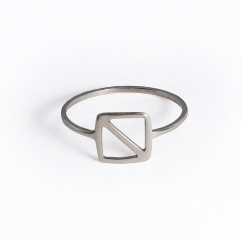 Sterling Silver Overboard Nautical Alphabet Flag Ring is in the shape of a square with a diagonal line inspired by the letter "O" nautical flag, the signal flag for "man overboard!" From a collection of symbolic jewelry by Tinker Company.