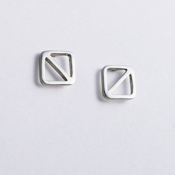 Overboard Flag Stud Earrings in sterling silver, nautical jewelry inspired by the letter O signal flag, they symbol for man overboard.