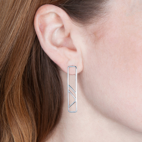 Pillar Earring as shown on a model's ear.
