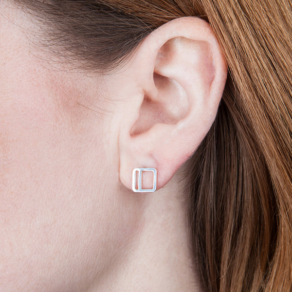 Square Stripe Stud Earring in sterling silver with the vertical stripe option, as shown on a model's ear.