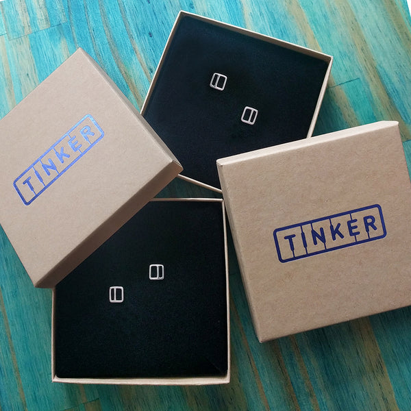 Square Stripe Stud Earrings shown in Tinker boxes.