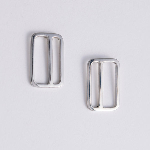 Rectangular Earrings with an offset stripe in sterling silver. Designed and made in New York City by Tinker Company.